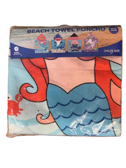 Packaged children's beach towel with cartoon design on a wooden surface