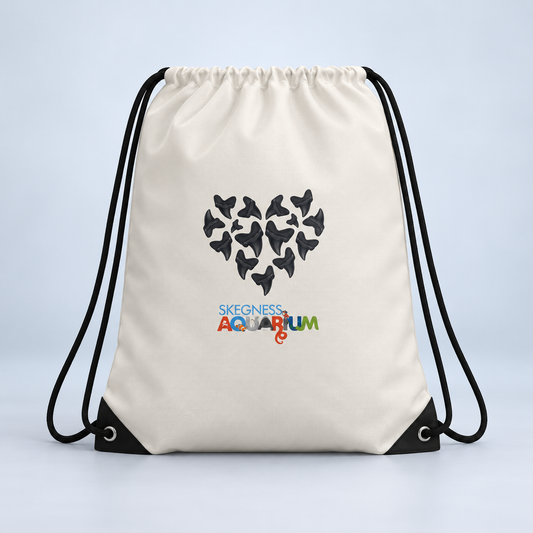 White drawstring bag printed with a heart made of sharks above the Skegness Aquarium logo